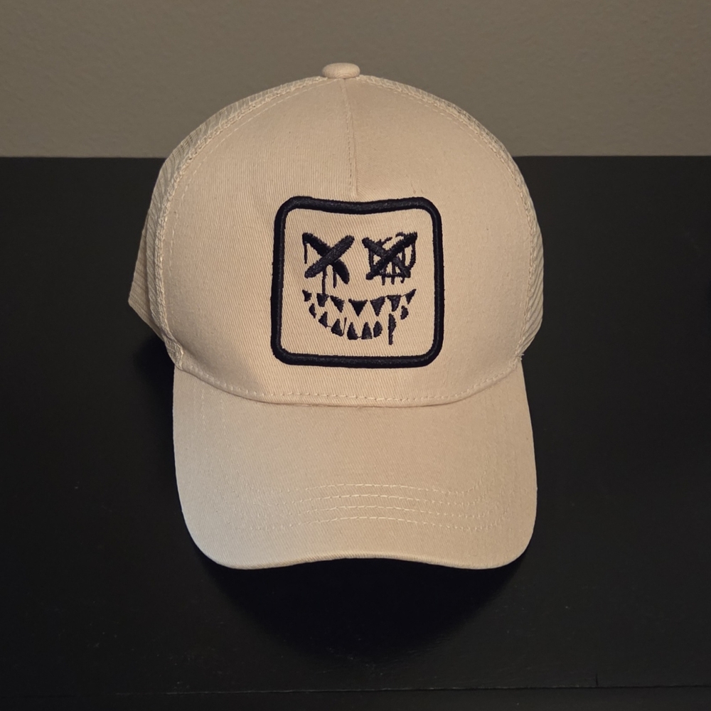 NWOT Beige Cap with Embroidered Face Design